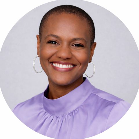 Celeste Angelic London smiling, in a lavender blouse